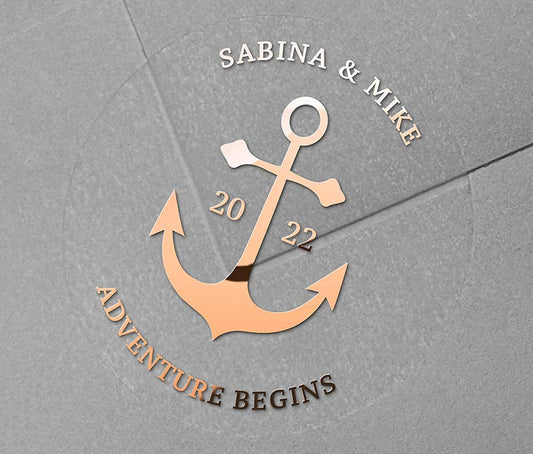 Navy theme Anchor graphic and personalised names rose gold foil printed on round clear wedding sticker
