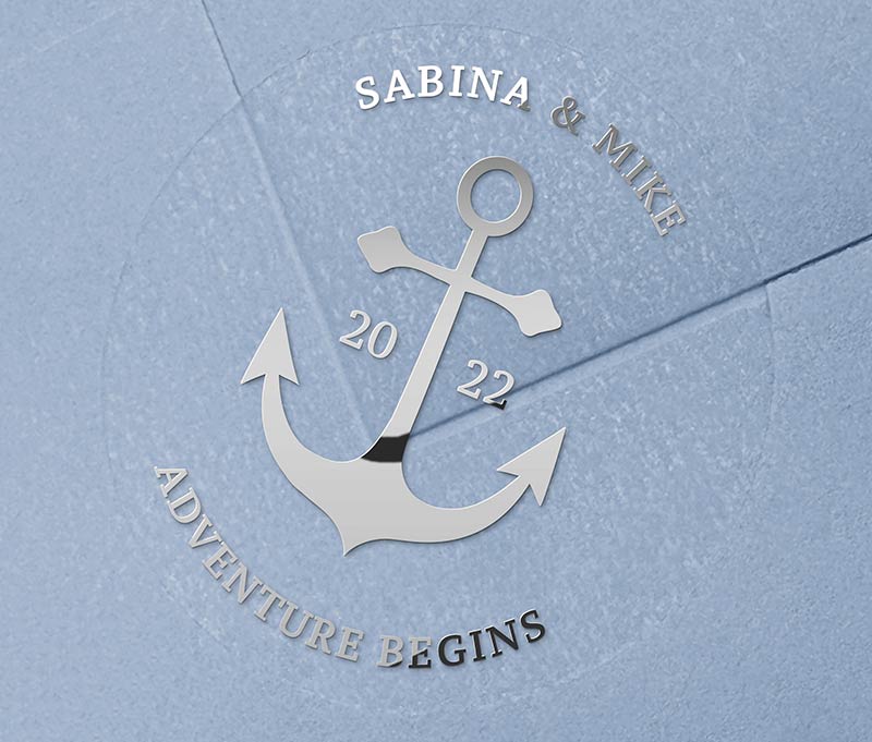 Navy theme Anchor graphic and personalised names silver foil printed on round clear wedding sticker
