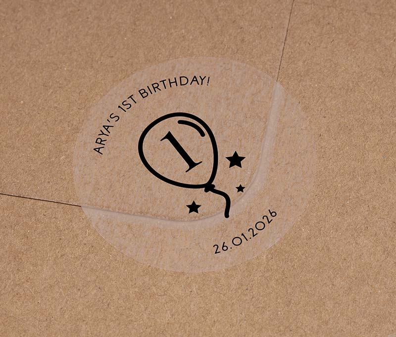 Birthday stickers with a balloon graphic and personalized name and date printed in black ink on a clear sticker