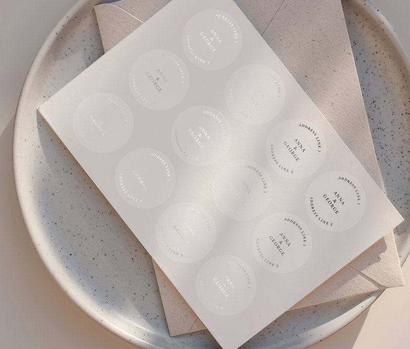 Return address label sheet printed in silver on clear round stickers