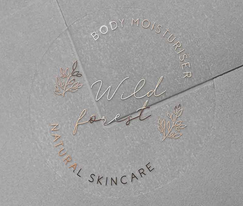 Personalised text for business name and custom text curved on top and bottom of round clear sticker printed in rose gold foil