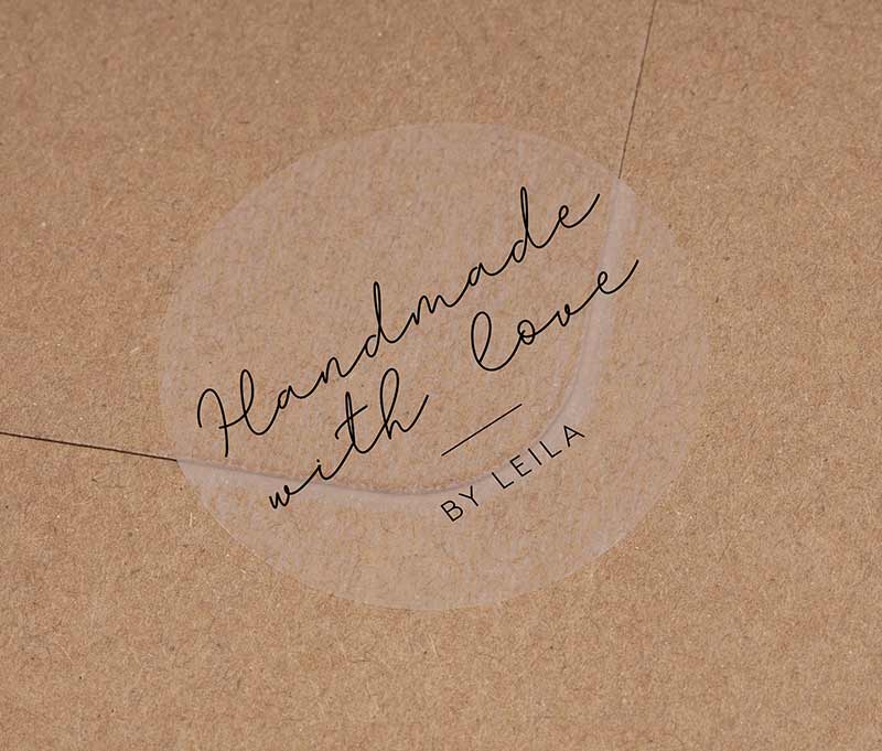 Handmade With Love sticker with personalized name printed in black on round clear sticker