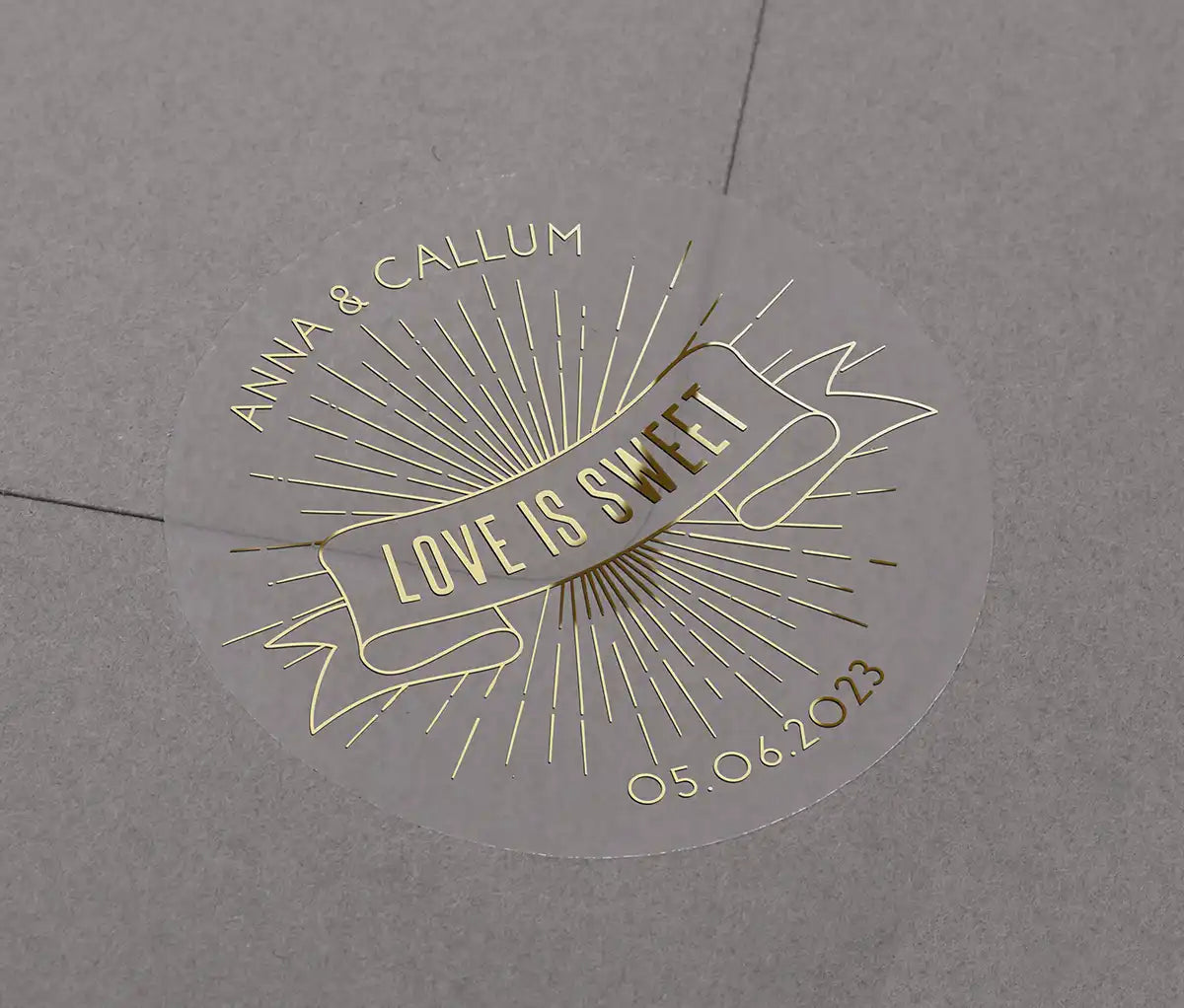 Love is sweet wedding favor sticker with personalized names and date printed in goldon clear sticker