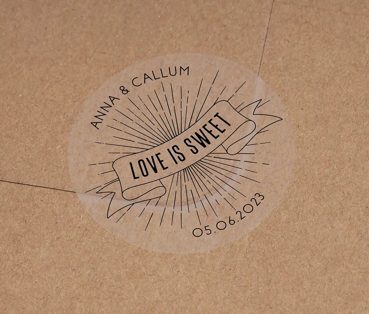 Love is sweet wedding favor sticker with personalized names and date printed in black on clear sticker
