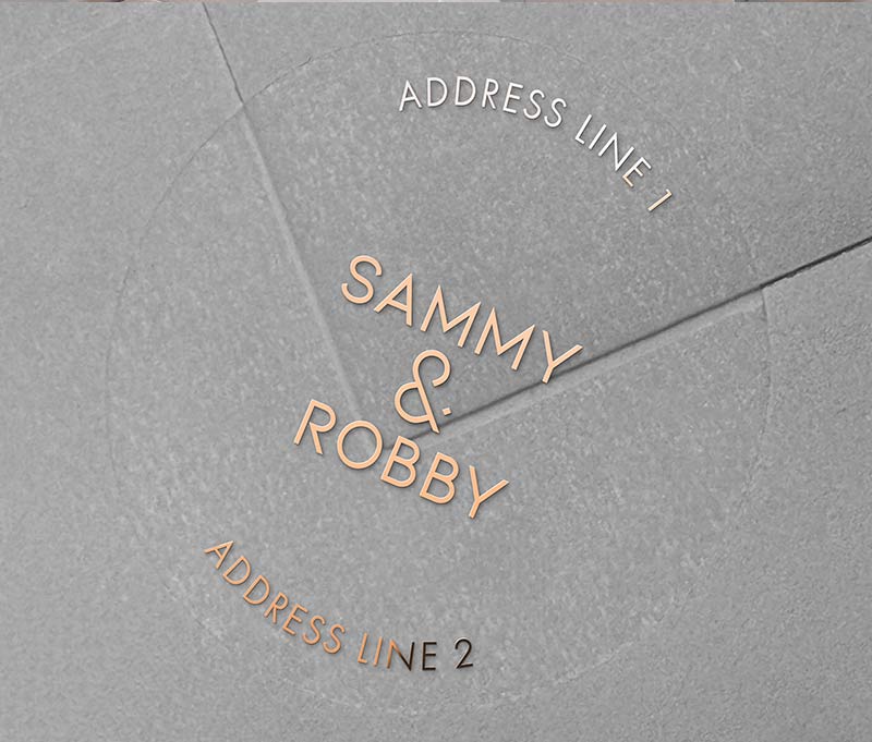 Return address labels with rose gold foil printing on clear round labels, applied to an envelope.