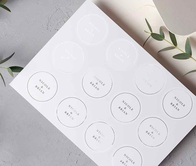 Silver wedding envelope sticker sheet with personalized names printed on round transparent frosted label