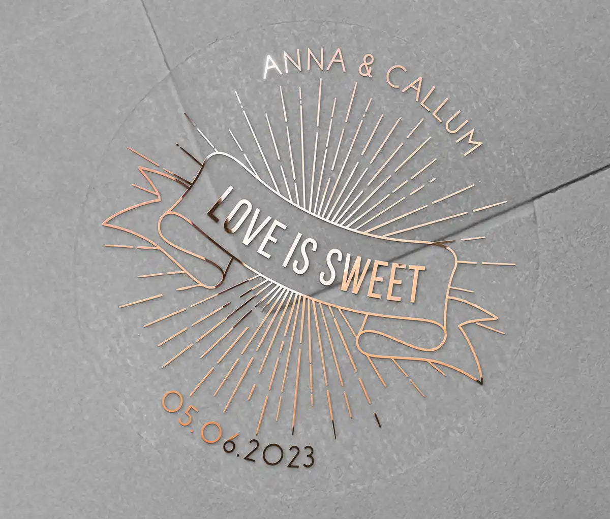 Love is sweet wedding favor sticker with personalized names and date printed in rose gold on clear sticker