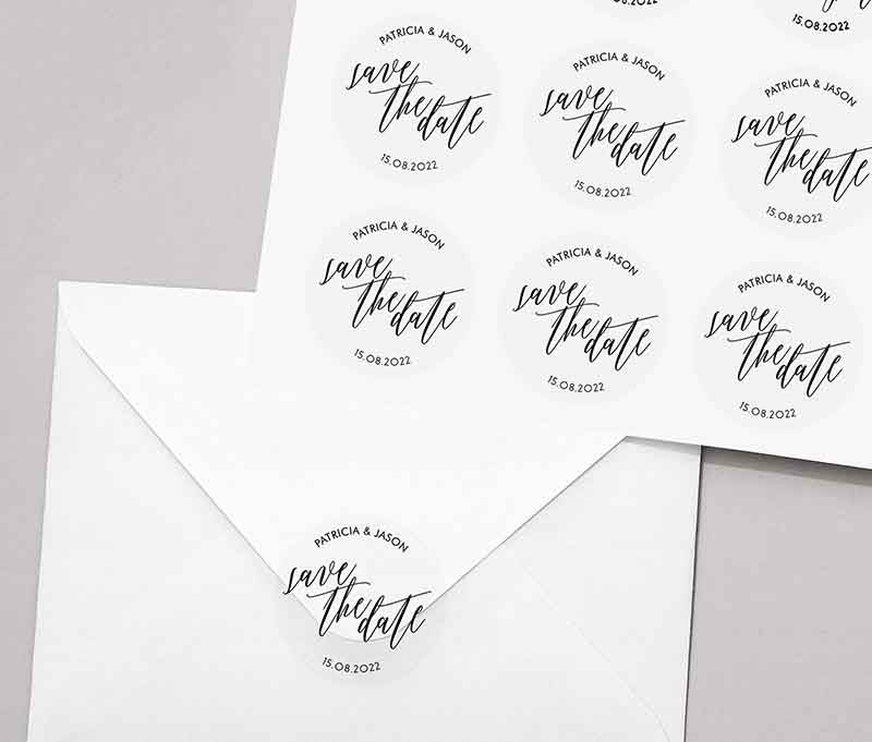 Save the date sticker sheet with personalized names and date printed on round clear labels