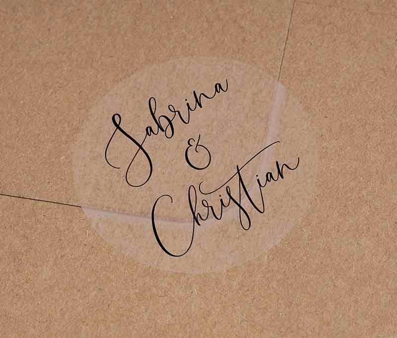 Wedding favor stickers with personalized names printed in gblack on clear round sticker
