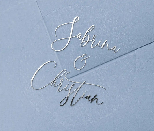 Wedding favour stickers with personalised names printed in silver foil on clear round sticker