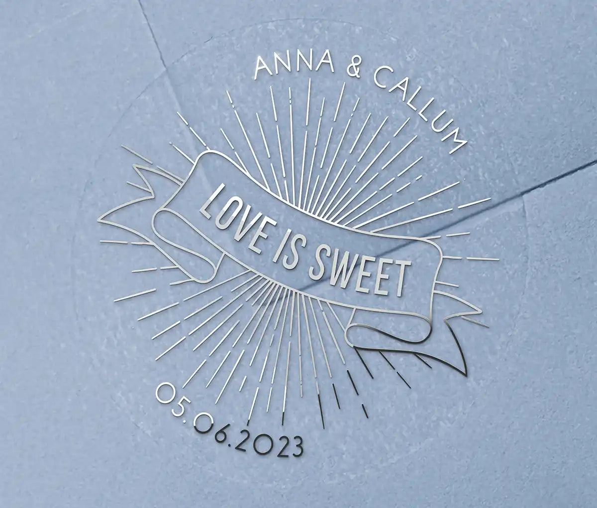 Love is sweet wedding favor sticker with personalized names and date printed in silver on clear sticker