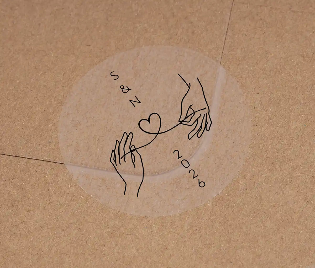 Wedding envelope sticker with personalised initials printed on clear sticker in black ink
