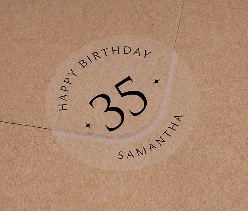 Personalized age and name birthday sticker printed in black ink on transparent frosted round sticker