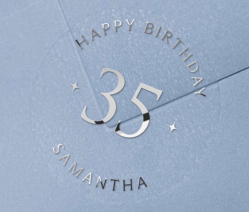 Personalized age and name birthday sticker printed in silver foil on transparent frosted round sticker