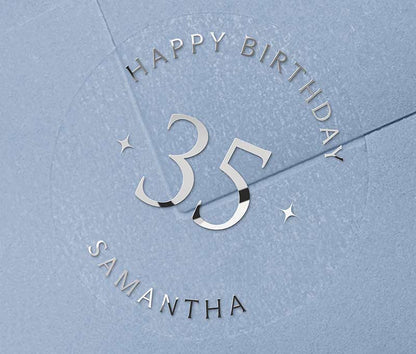 Personalized age and name birthday sticker printed in silver foil on transparent frosted round sticker