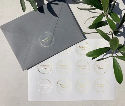 Business name stickers printed in gold on clear sticker material