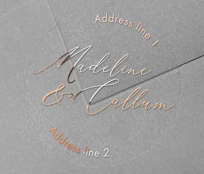 Return address labels printed in rose gold on clear round sticker with names in script font