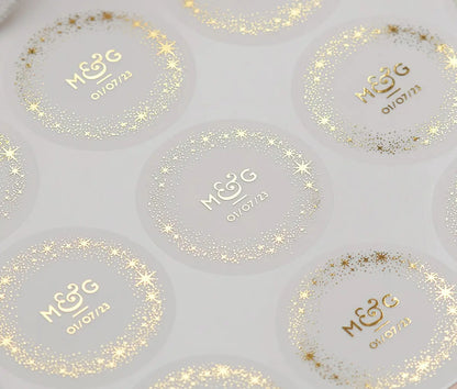 Sticker speet with personalized gold foil print initials, a date and a starry frame on round frosted stickers