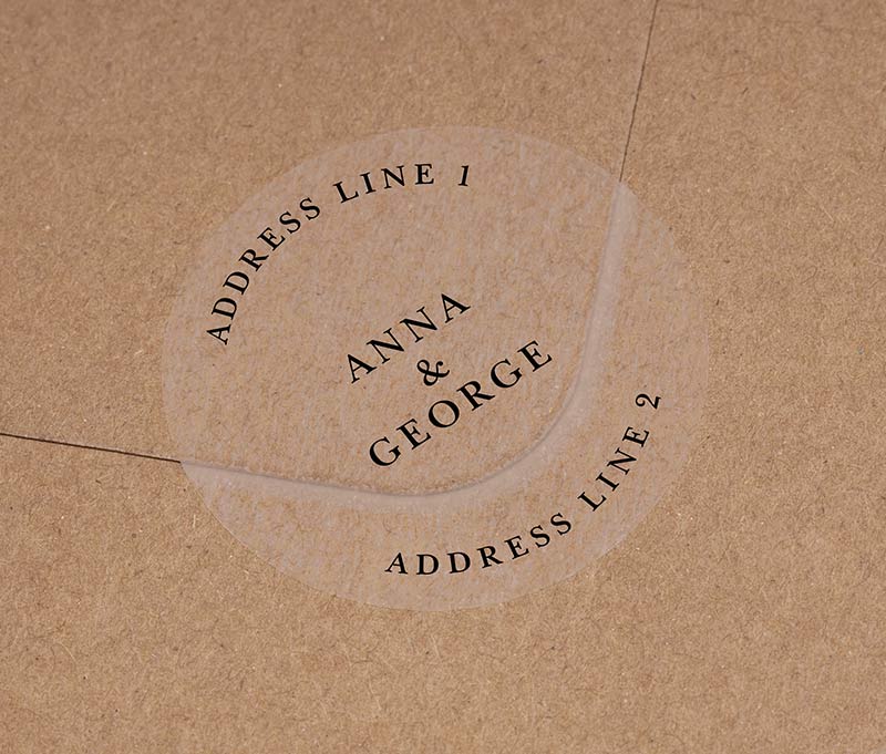 Return address labels printed in black on clear round sticker
