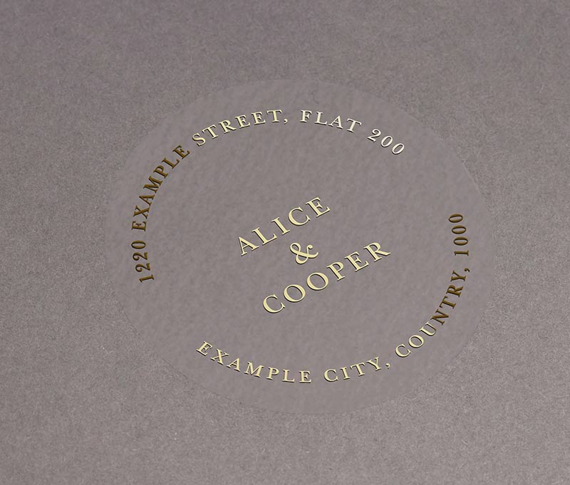 Return address labels printed in gold on clear round sticker