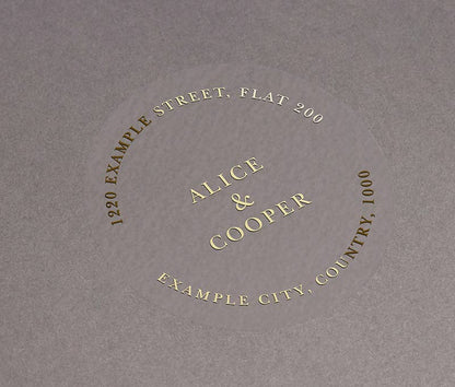 Return address labels printed in gold on clear round sticker