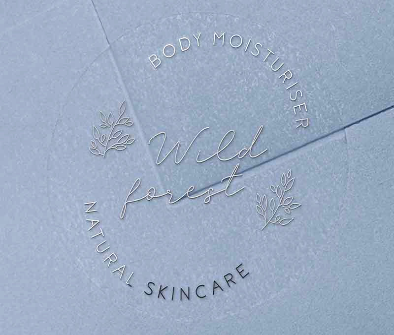 Personalised text for business name and custom text curved on top and bottom of round clear sticker printed in silver foil