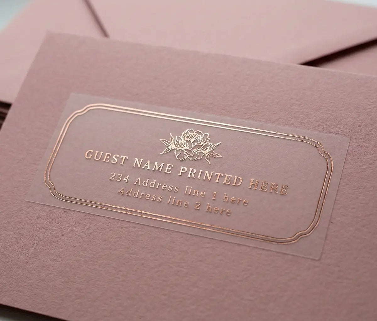 Muted Pink envelope with floral theme guest address label with peony graphic printed in gold foil on transparent vinyl.