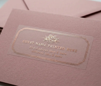 Muted Pink envelope with floral theme guest address label with peony graphic printed in gold foil on transparent vinyl.