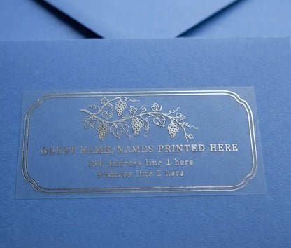 Vineyard inspired guest address label printed in silver foil on clear matte vinyl and applied to a blue envelope.