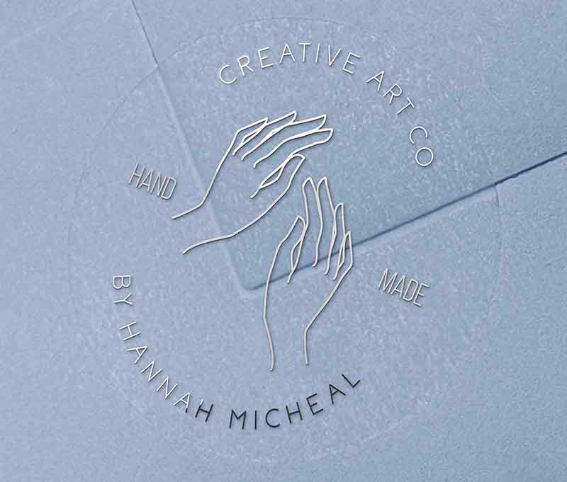 Personalized Handmade business stickers with custom text curved on top and bottom of the sticker printed in silver foil