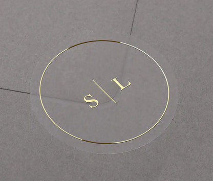 Minimalist Wedding envelope stickers with personalized initials printed in gold on clear round label