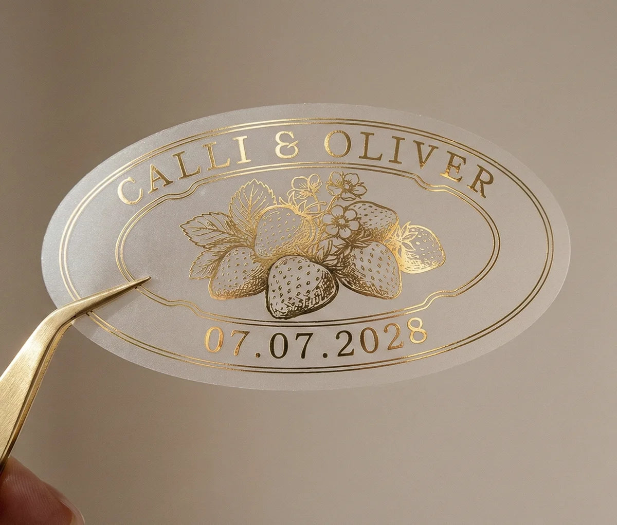 Personalized oval shape strawberry jam favor sticker printed in gold foil on transparent matte vinyl.