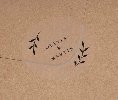 Wedding envelope seal with personalized names and laurel leaves graphic printed in black on round transparent frosted label