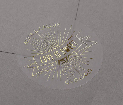 Love is sweet wedding favor sticker with personalized names and date printed in goldon clear sticker