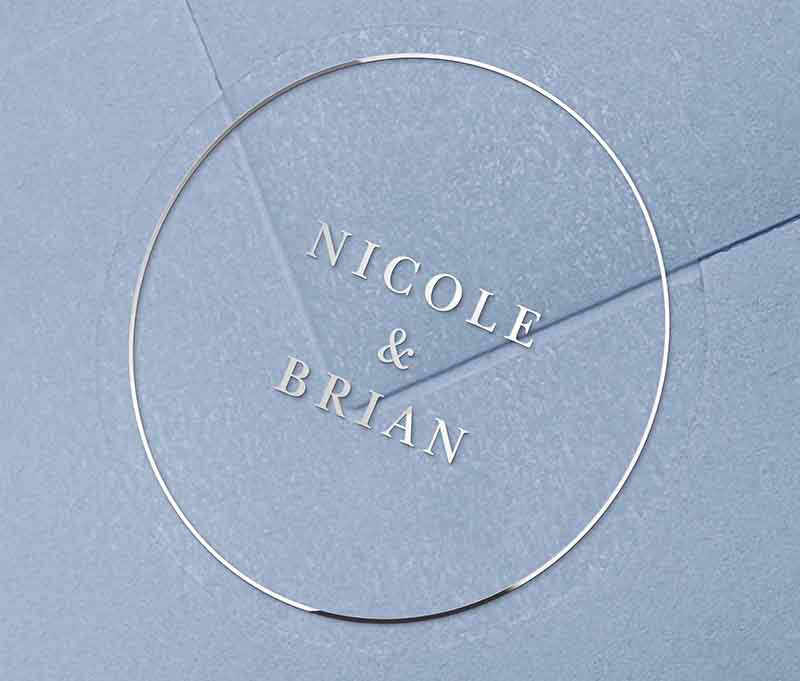 Silver envelope sticker with personalized names printed on round transparent frosted label