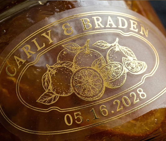 Oval personalized gold print transparent wedding favour label for orange marmalade.