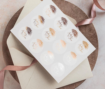 Wedding envelope sticker sheet with personalized names and palm image printed in rose gold on clear label