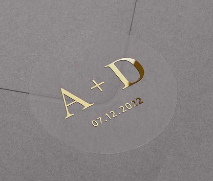 Clear wedding envelope stickers with personalized gold foiled initials and date