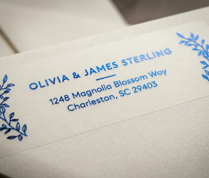 Return Address Label with Mediterranean Botanical Motif printed in Royal Blue foil on transparent matte labels applied to a ivory envelope.