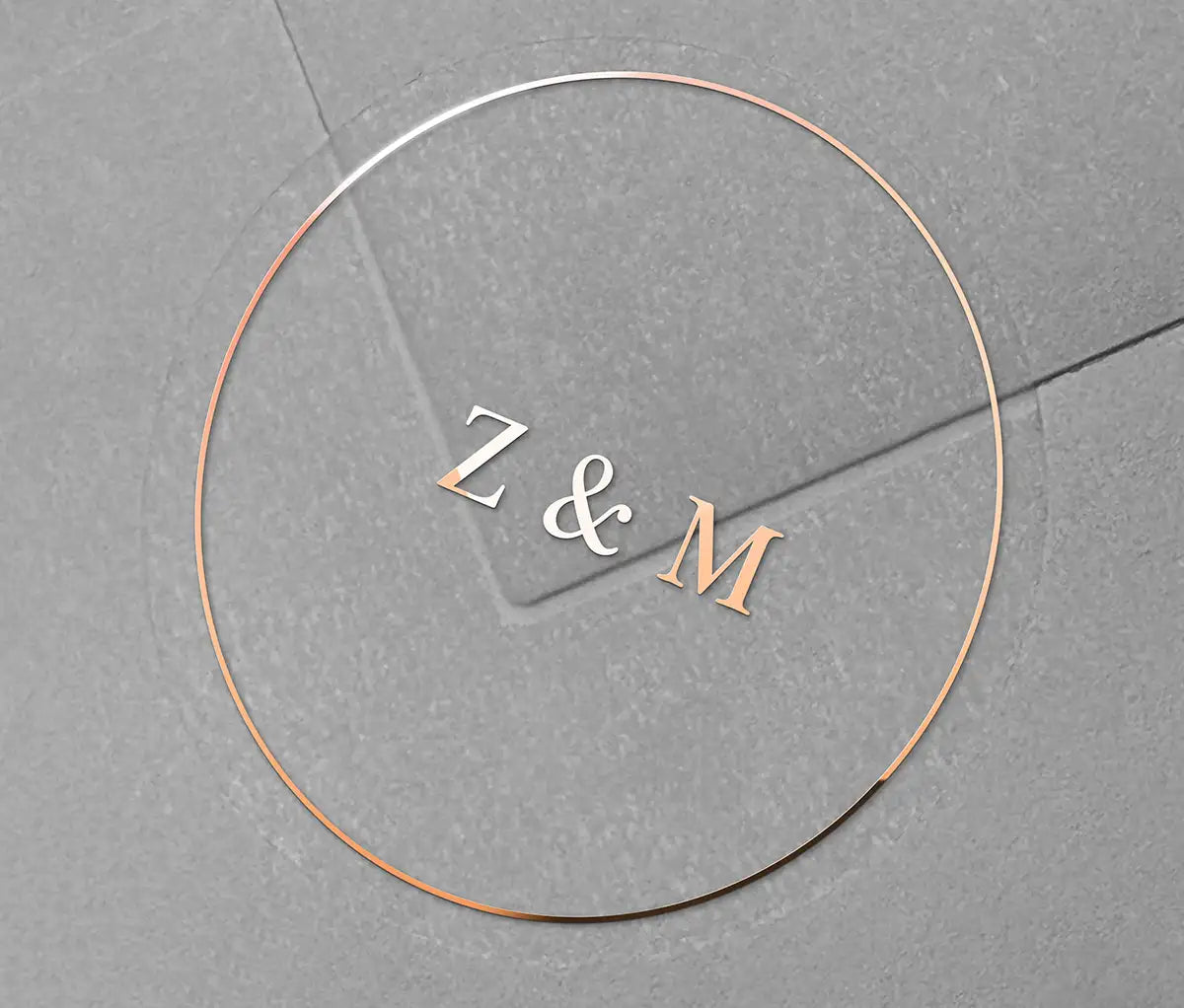 Wedding envelope sticker with personalized initials printed in rose gold on a clear sticker