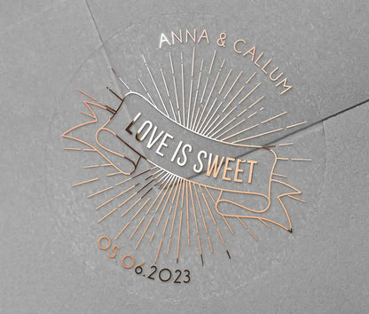 Love is sweet wedding favor sticker with personalized names and date printed in rose gold on clear sticker