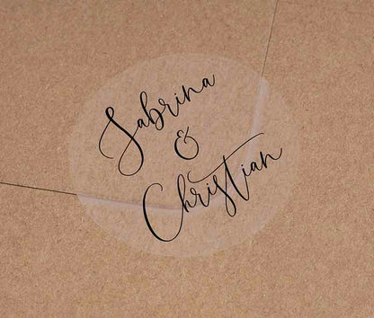 Wedding favor stickers with personalized names printed in gblack on clear round sticker