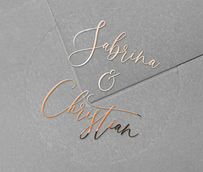 Wedding favor stickers with personalized names printed in rose gold foil on clear round sticker