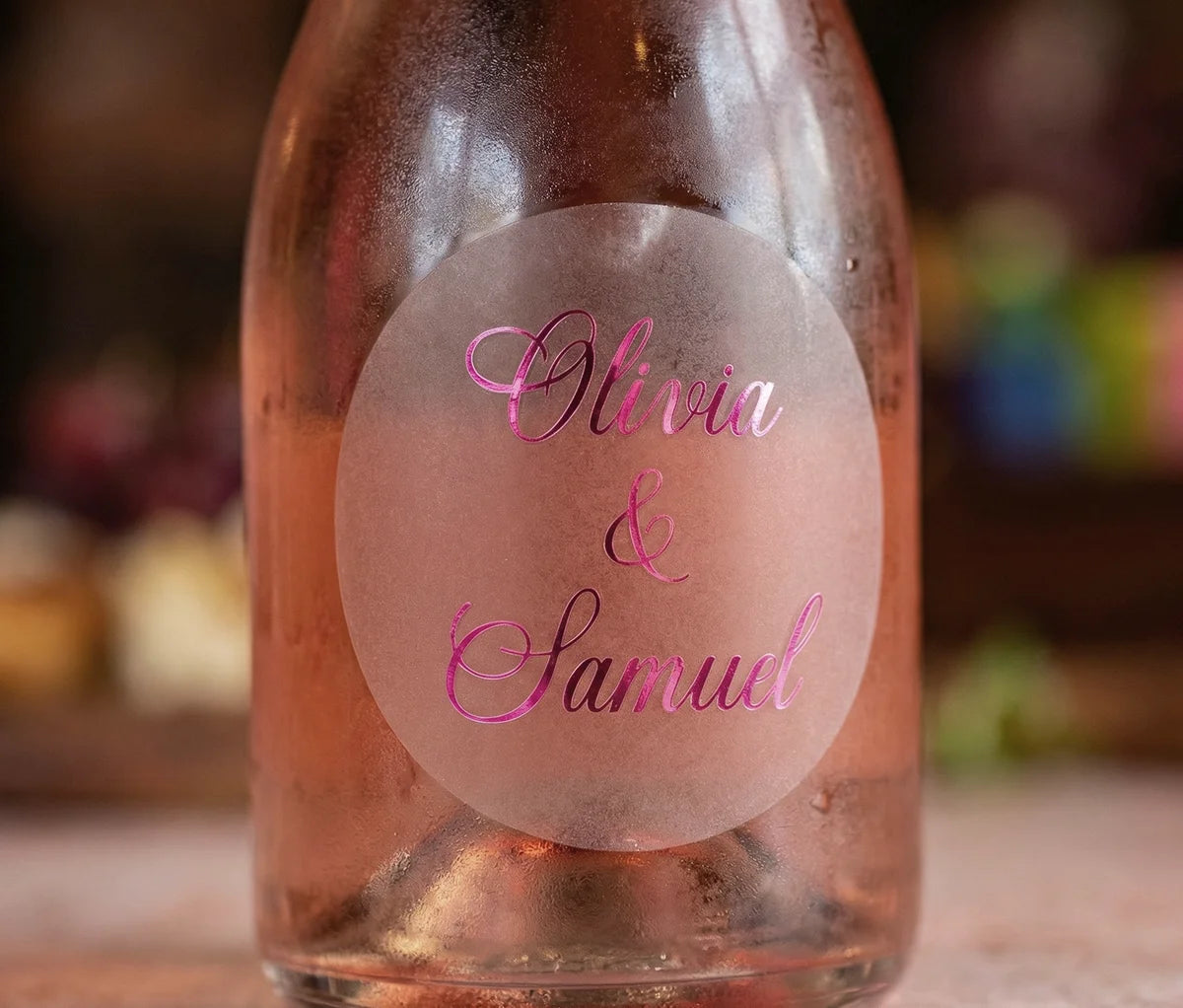 Rose wine bottle with personalized frosted label printed in hot pink foil
