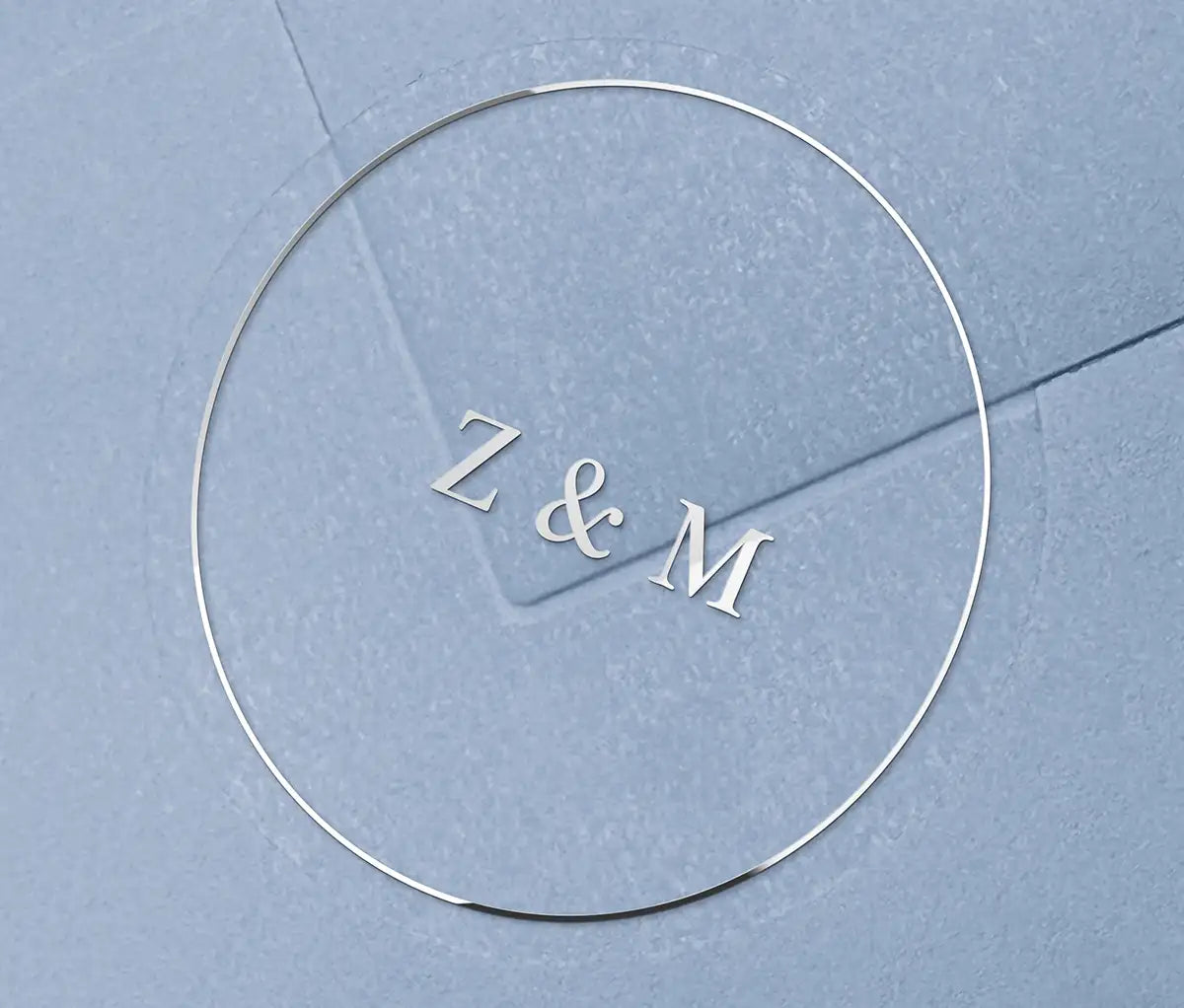 Wedding envelope sticker with personalized initials printed in silver on a clear sticker