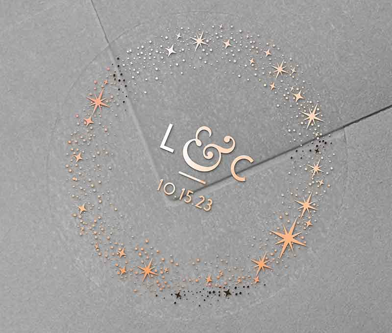 Celestial wedding envelope stickers with stars around personalized initials and date printed in rose gold on clear sticker