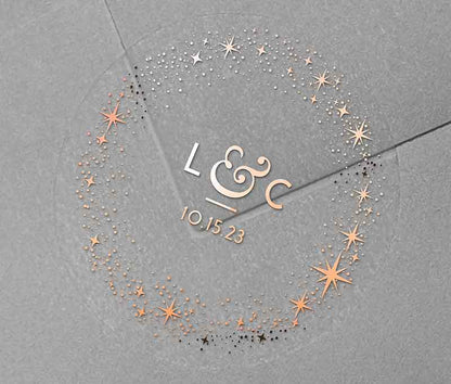 Celestial wedding envelope stickers with stars around personalized initials and date printed in rose gold on clear sticker