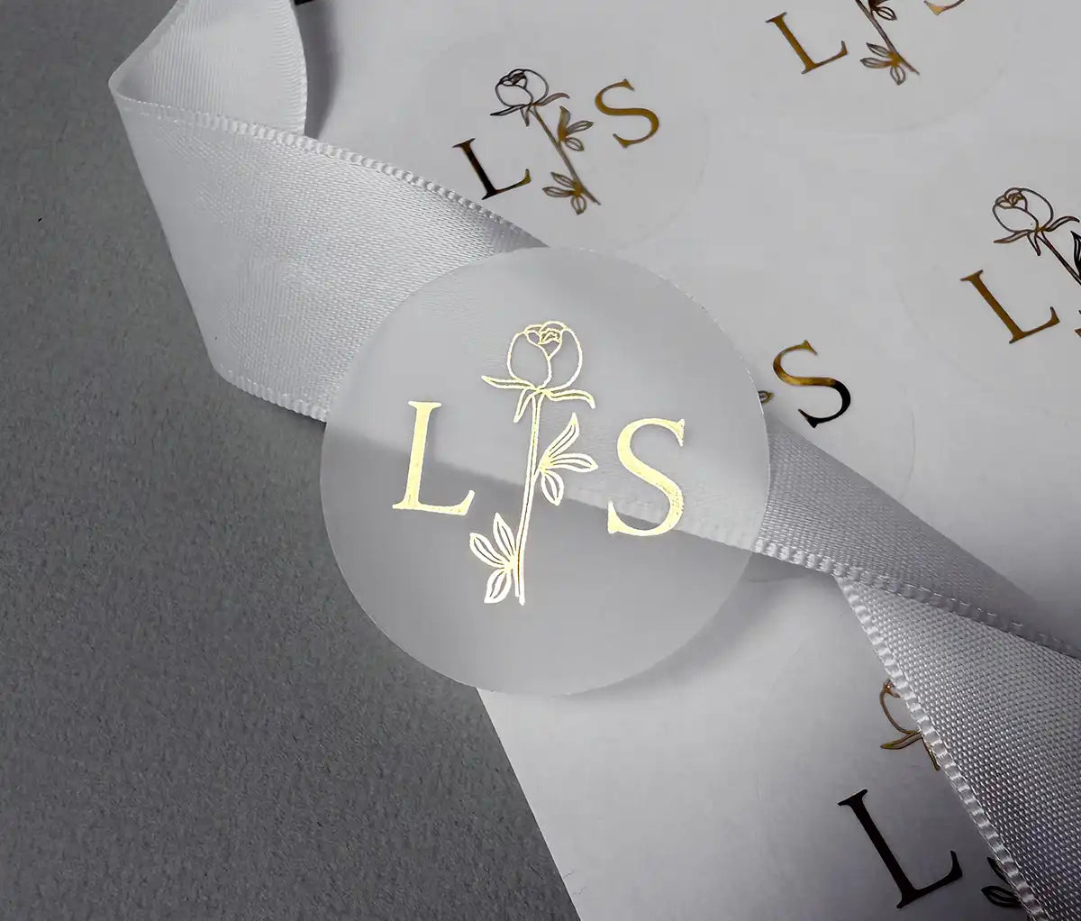 Personalised initials and floral rose graphic printed in gold on clear sticker