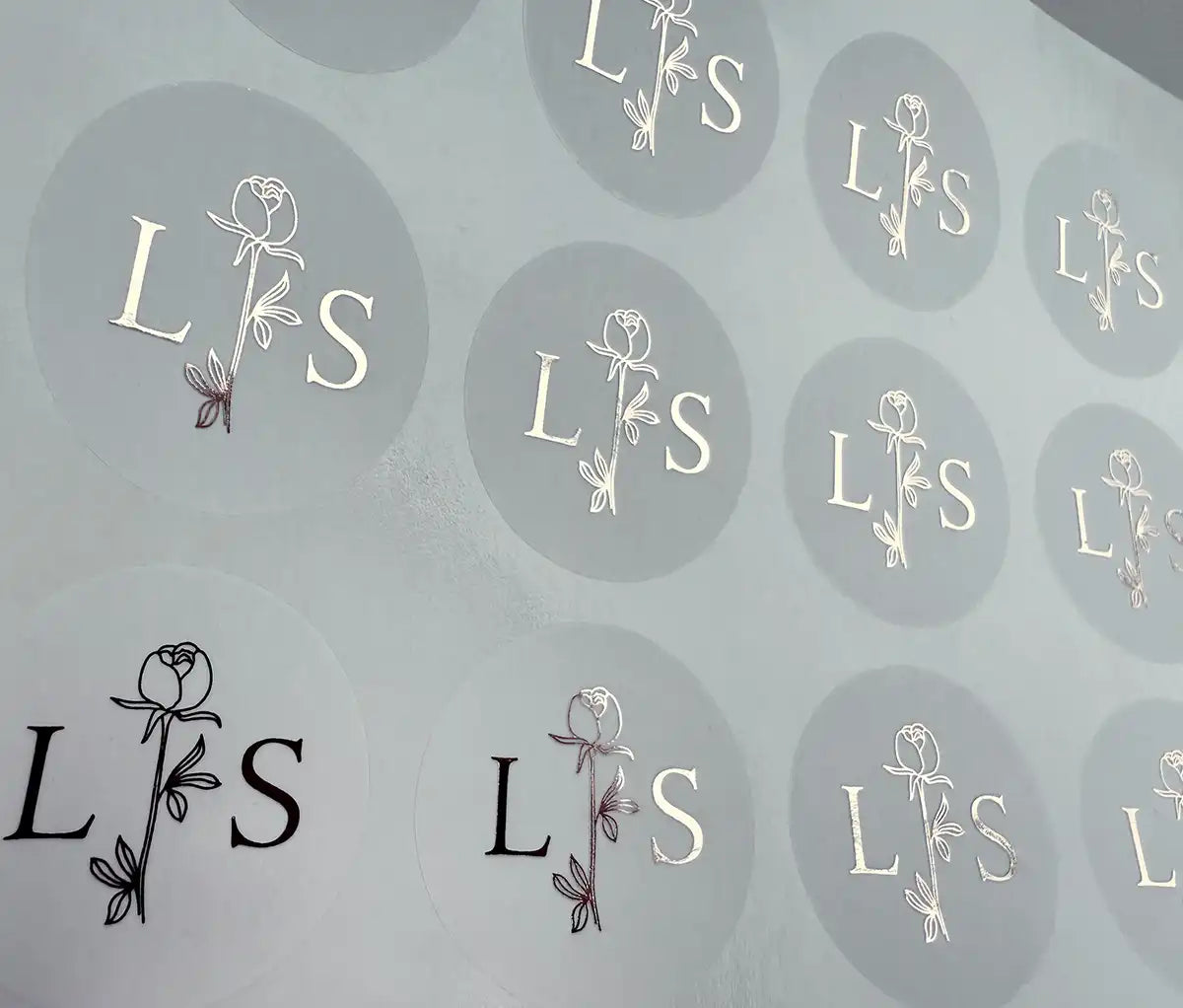 Personalised initials and floral rose graphic printed in silver on clear sticker sheet