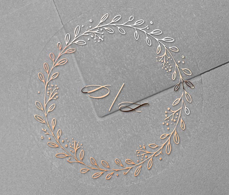 Wedding envelope sticker with wreath graphic and rose gold foil printed personalized initials.